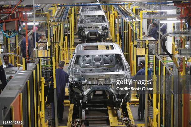 Workers assemble Ford vehicles at the Chicago Assembly Plant on June 24, 2019 in Chicago, Illinois. Ford recently invested $1 billion to upgrade the...