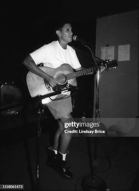 Susan Gottlieb, known as Phranc, on acoustic guitar, stands and sings into mic at Free 2 Fight event of the Riot Grrrl Convention at Macondo in East...