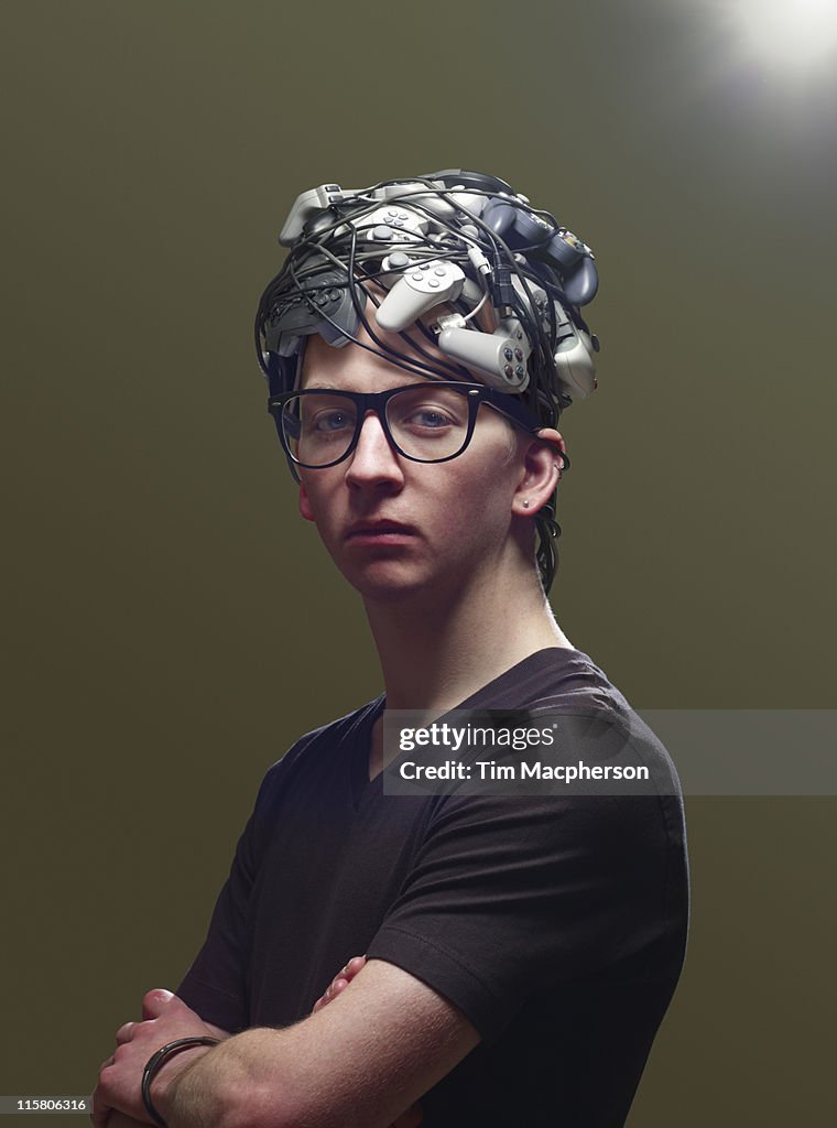 Young man with hair made from game controllers