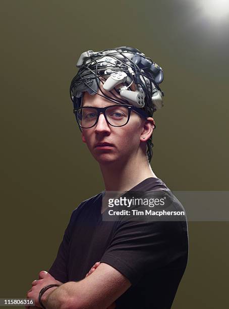 young man with hair made from game controllers - high standards stock pictures, royalty-free photos & images
