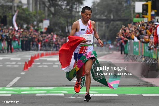 Peru´s Christian Pacheco crosses the finish line to win the gold medal at the men's Marathon of the Pan-American Games Lima 2019 in Lima, Peru on...