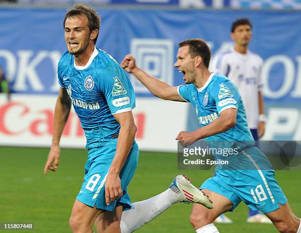 Danko Lazovic and Konstantin Zyryanov of FC Zenit St. Petersburg celebrate after scoring a goal during the Russian Football League Championship match...