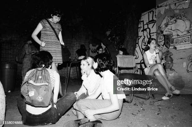 Riot Grrrl Convention attendees in courtyard behind Jabberjaw between bands’ sets in East Hollywood on July 29, 1995 in Los Angeles, California.