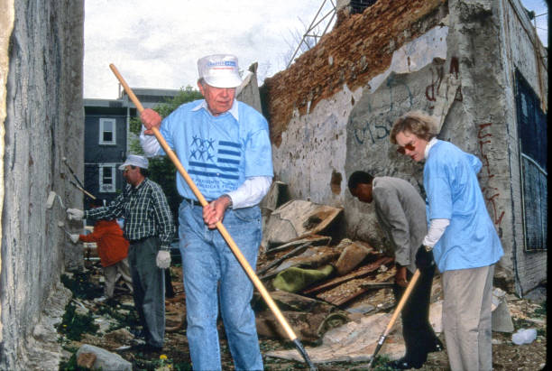 Bill Tompkins/Getty Images Former President Jimmy Carter and former First Lady Rosalyn Carter working with Habitat for Humanity restoring homes May...
