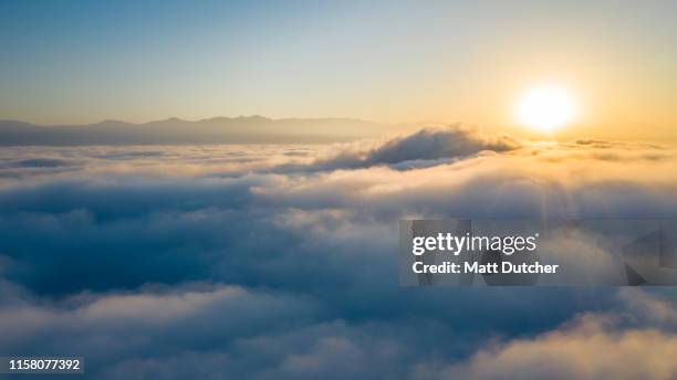 flying above the clouds - over imagens e fotografias de stock