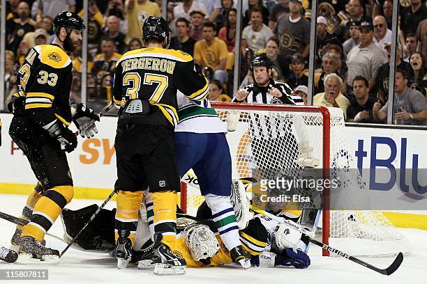 Tim Thomas of the Boston Bruins lays on the ground after a save against the Vancouver Canucks during Game Four of the 2011 NHL Stanley Cup Final at...