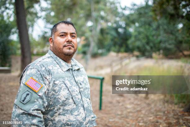 portrait of a latino veteran - military grave stock pictures, royalty-free photos & images