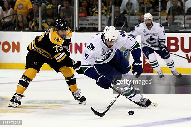 Michael Ryder of the Boston Bruins skates against Ryan Kesler of the Vancouver Canucks during Game Four of the 2011 NHL Stanley Cup Final at TD...