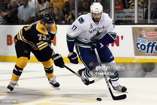 Michael Ryder of the Boston Bruins skates against Ryan Kesler of the Vancouver Canucks during Game Four of the 2011 NHL Stanley Cup Final at TD...