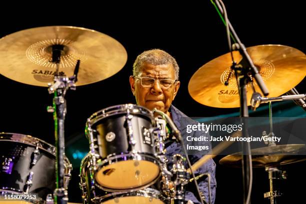 American Jazz musician Jack DeJohnette plays drums as he performs onstage, with the DeJohnette-Coltrane-Garrison Trio, during a Blue Note Jazz...