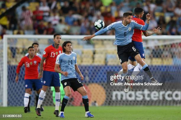 Rodrigo Bentancur of Uruguay heads for the ball with Pedro Pablo Hernandez of Chile during the Copa America Brazil 2019 group C match between Chile...