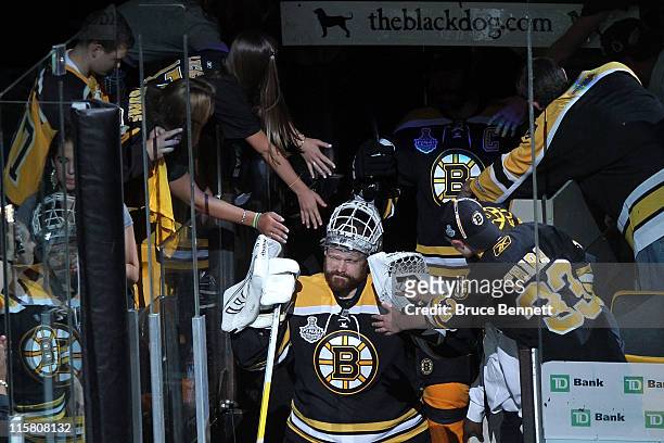 Tim Thomas of the Boston Bruins walks to the ice from the locker room prior to the start of Game Four against the Vancouver Canucks in the 2011 NHL...