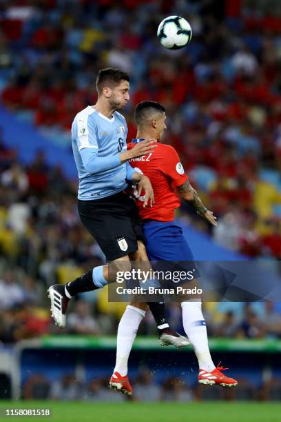 Rodrigo Bentancur of Uruguay heads for the ball with Pedro Pablo Hernandez of Chile during the Copa America Brazil 2019 group C match between Chile...