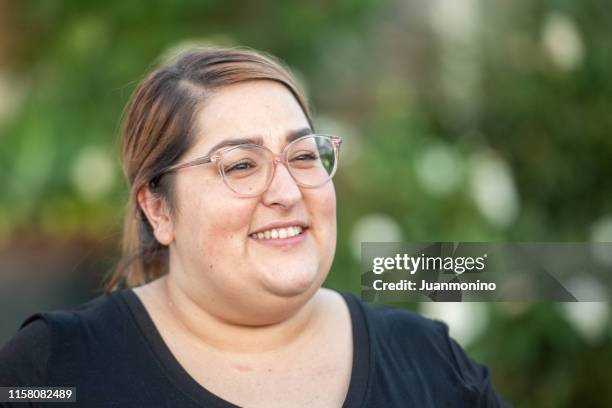 smiling mid adult woman looking away - fat lesbian stock pictures, royalty-free photos & images