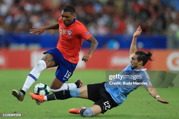 Junior Fernandes of Chile competes for the ball with Martin Caceres of Uruguay during the Copa America Brazil 2019 group C match between Chile and...