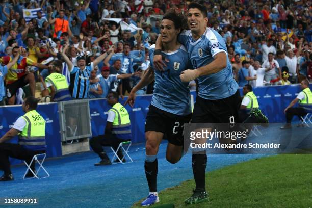 Edinson Cavani of Uruguay celebrates with teammate Luis Suarez after scoring the first goal of his team during the Copa America Brazil 2019 group C...