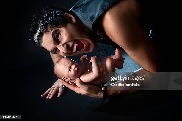 male vampire and a baby. - murder mystery stock pictures, royalty-free photos & images