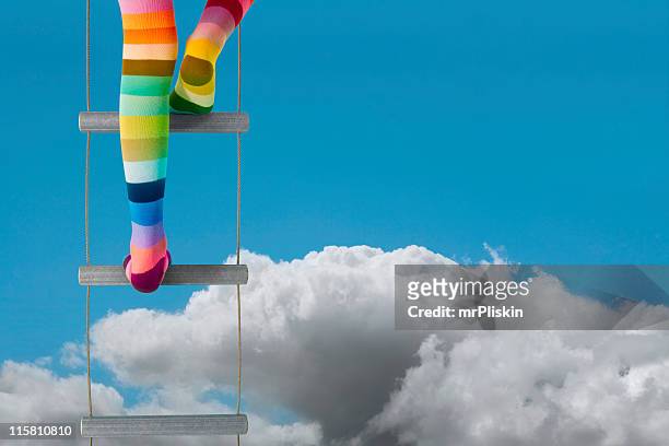 レインボーレッグスクライミング in the sky - agility ladder ストックフォトと画像