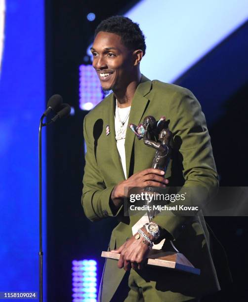 Lou Williams accepts the Kia NBA Sixth Man of the Year Award onstage during the 2019 NBA Awards presented by Kia on TNT at Barker Hangar on June 24,...