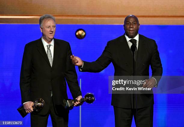 Larry Bird and Magic Johnson accept the Lifetime Achievement Awards onstage during the 2019 NBA Awards presented by Kia on TNT at Barker Hangar on...