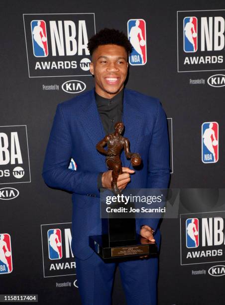 Giannis Antetokounmpo, winner of the Kia NBA Most Valuable Player award, poses in the press room during the 2019 NBA Awards presented by Kia on TNT...