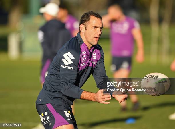 Cameron Smith of the Storm passes the ball during a Melbourne Storm NRL training session at Gosch's Paddock on June 25, 2019 in Melbourne, Australia.