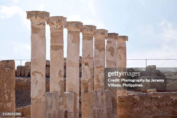 ancient columns, house of theseus, paphos archaeological park - theseus stock pictures, royalty-free photos & images