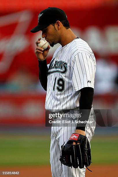 Anibal Sanchez of the Florida Marlins kisses the ball before delivering the first pitch against the Arizona Diamondbacks at Sun Life Stadium on June...