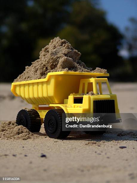 toy dump truck on beach - dumper bildbanksfoton och bilder