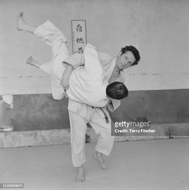 British aristocratic and pottery designer David Douglas, 12th Marquess of Queensberry practicing judo with his instructor, UK, 5th March 1965.
