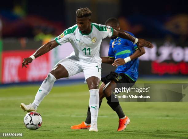 Of Senegal and SAIMON HAPPYGOD MSUVA of Tanzania during the 2019 Africa Cup of Nations Group C match between Senegal and Tanzania at 30th June...