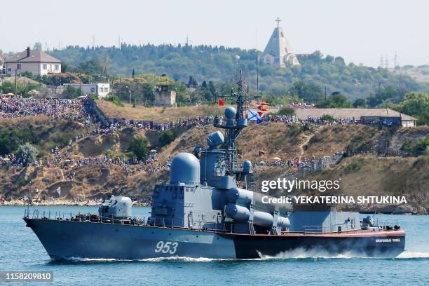 Russian Navy missile launcher ship Naberezhnye Chelny sails during a parade as part of the Navy Day celebration in Sevastopol on July 28, 2019.