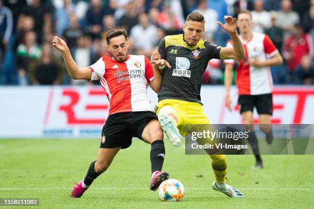 Orkun Kokcu of Feyenoord, Jan Bednarek of Southampton FC during the Pre-season Friendly match between Feyenoord and Southampton FC at the Kuip on...