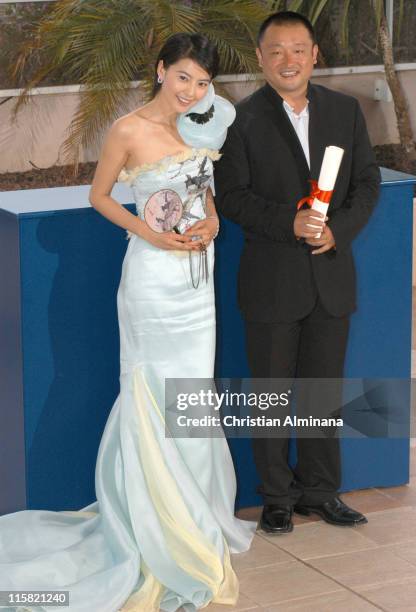 Wang Xiaoshuai and YuanYuan Gao during 2005 Cannes Film Festival - Cannes Awards Photocall at Palais de Festival in Cannes, France.