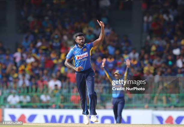 Sri Lankan cricketer Isuru Udana celebrates after taking a wicket during the 2nd One Day International cricket match between Sri Lanka and Bangladesh...