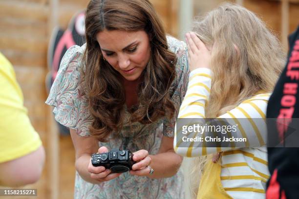 Catherine, Duchess of Cambridge and photographer Jillian Edelstein join a photography workshop for Action for Children, run by the Royal Photographic...