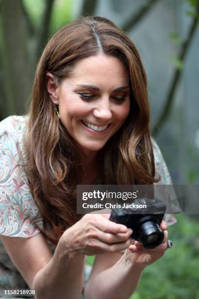 Catherine, Duchess of Cambridge joins a photography workshop for Action for Children, run by the Royal Photographic Society at Warren Park on June...