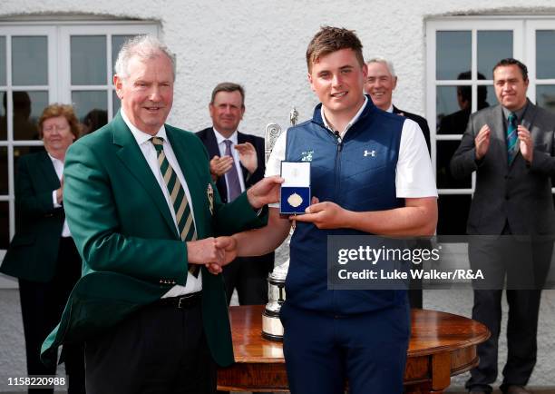 James Sugrue of Ireland winner of the R&A Amateur Championship poses with the trophy during day six of the R&A Amateur Championship at Portmarnock...