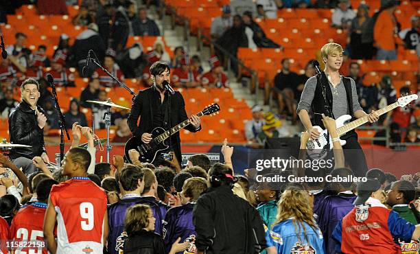 Musicians Alexander Noyes, Michael Bruno and Andrew Lee of Honor Society perform the national anthem at the 2010 Pro Bowl at Sun Life Stadium on...