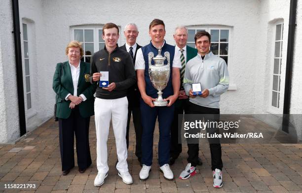 Euan Walker of Scotland, James Sugrue of Ireland and David Micheluzzi of Australia during the trophy presentation during day six of the R&A Amateur...