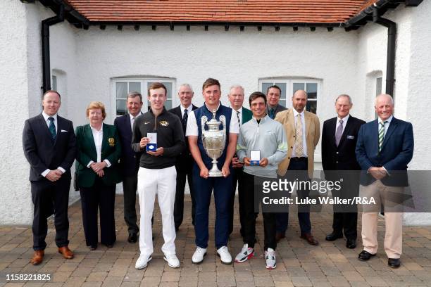 Euan Walker of Scotland, James Sugrue of Ireland and David Micheluzzi of Australia during the trophy presentation during day six of the R&A Amateur...