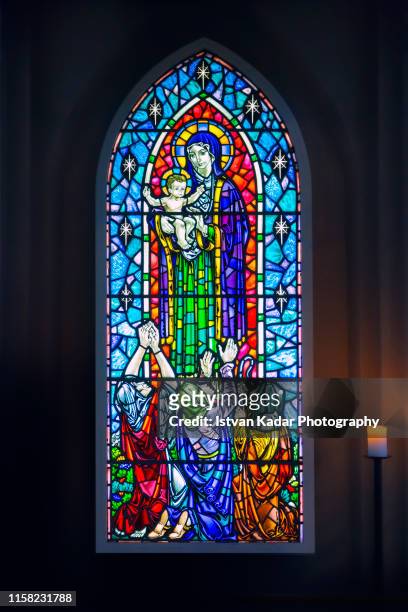 stained glass window at hallgrimskirkja church, reykjavik, iceland - stained glass church stock pictures, royalty-free photos & images