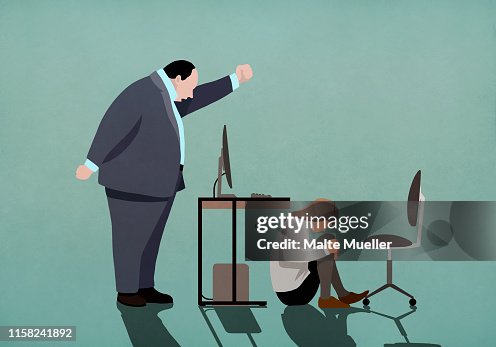 Angry businessman threatening businesswoman crouched under desk Angry businessman threatening businesswoman crouched under desk