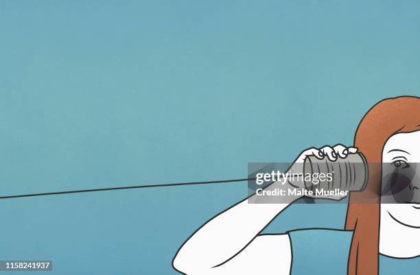 woman listening in tin can telephone - communication problems stock illustrations