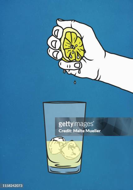 hand squeezing fresh lime into glass with ice - saftpresse stock-grafiken, -clipart, -cartoons und -symbole