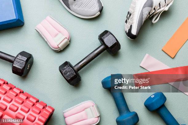 view from above dumbbells and exercise equipment - knolling - sports equipment stock pictures, royalty-free photos & images