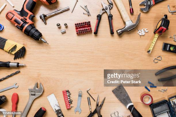 view from above tools arranged in circle on wooden surface - knolling - trestles stock pictures, royalty-free photos & images