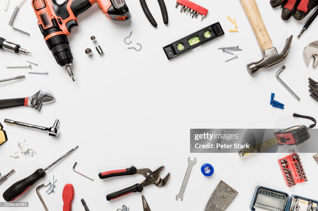 View from above tools in circle on white background - knolling
