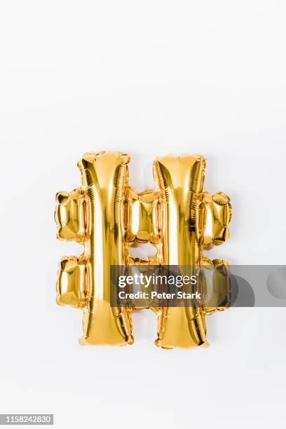 hashtag gold balloon on white background - hashtag stock pictures, royalty-free photos & images