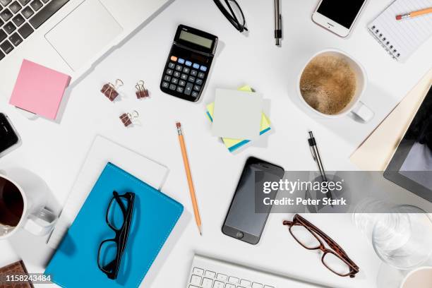 view form above belongings on messy desk - office supply stock pictures, royalty-free photos & images